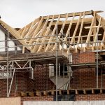 Europe, UK, England, Surrey, scaffolding on house roof renovation